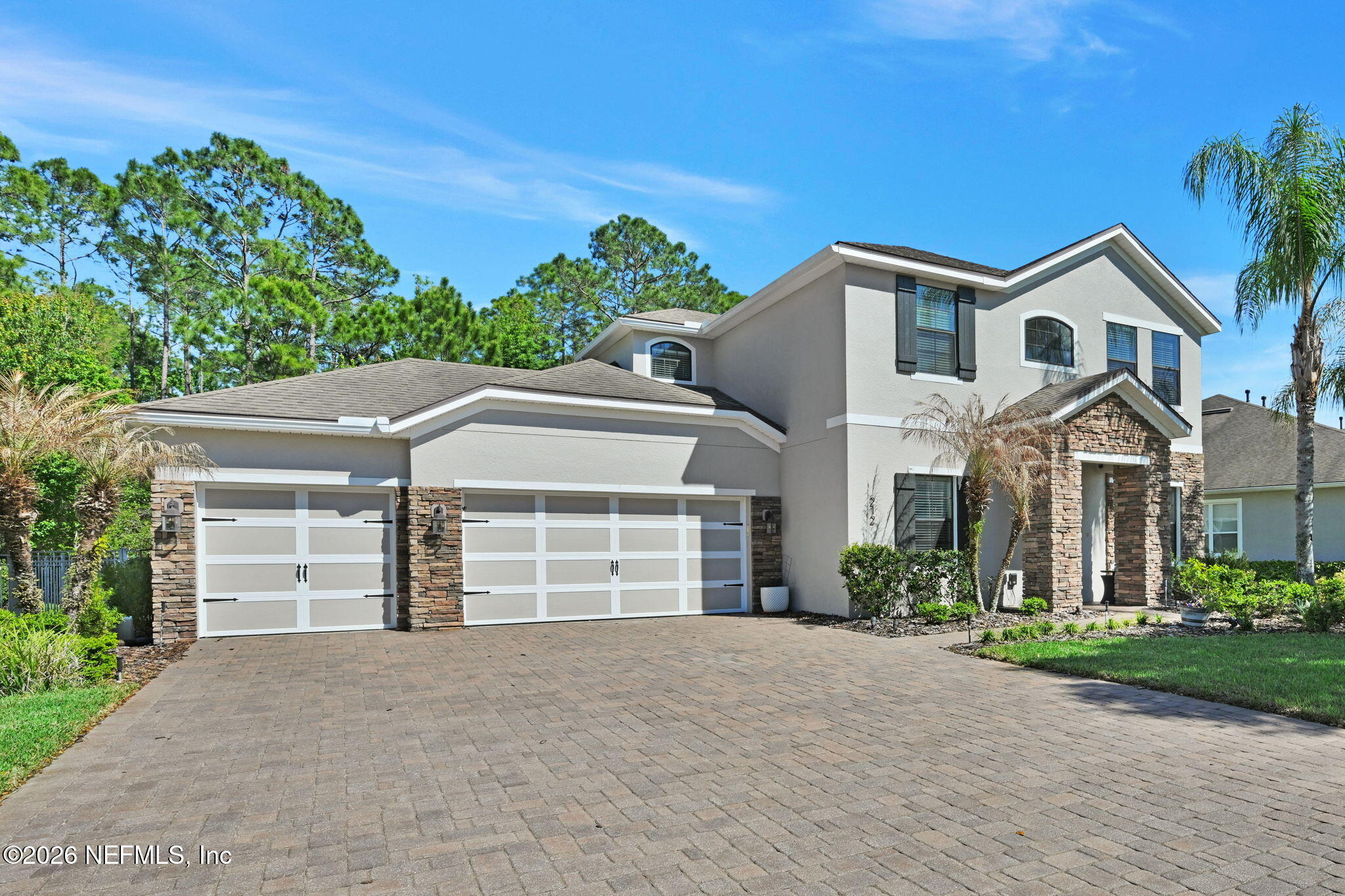 212 North Arabella Way St. Johns, FL 32259 - Photo 7 of 83 a front view of a house with a yard