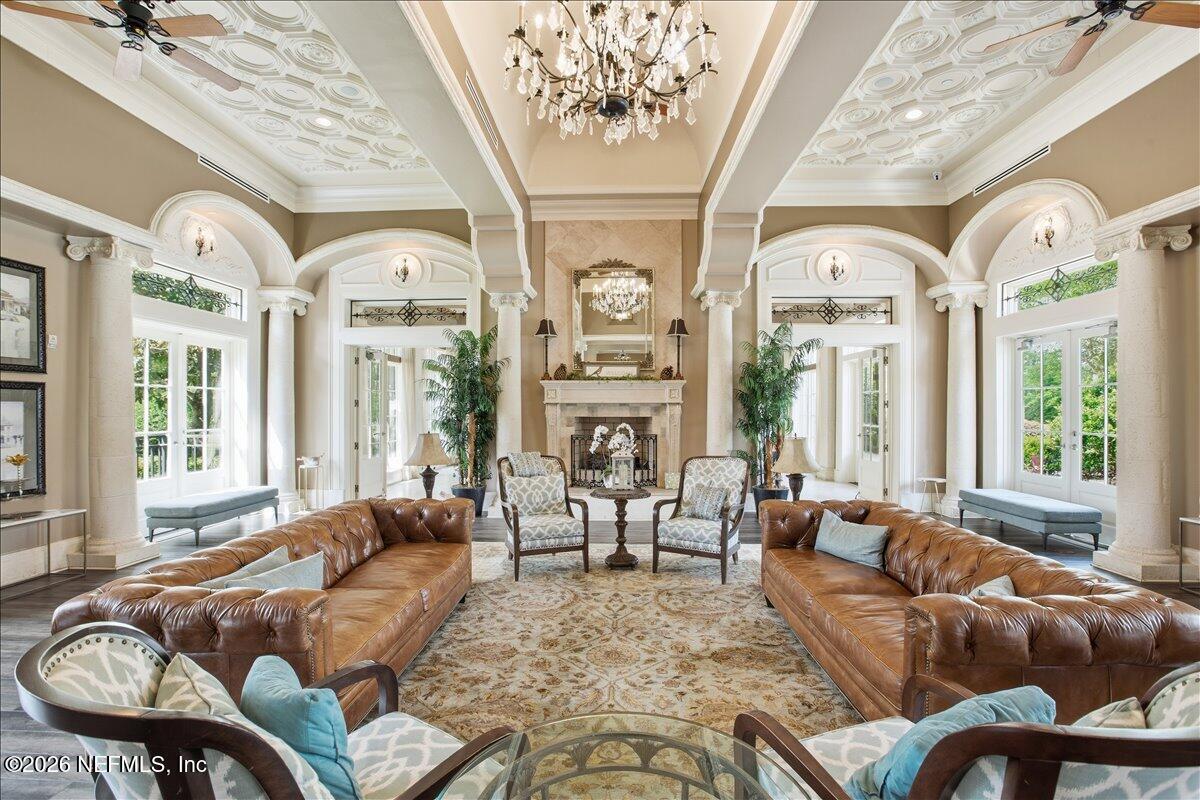212 North Arabella Way St. Johns, FL 32259 - Photo 75 of 83 a living room with furniture chandelier and a large window
