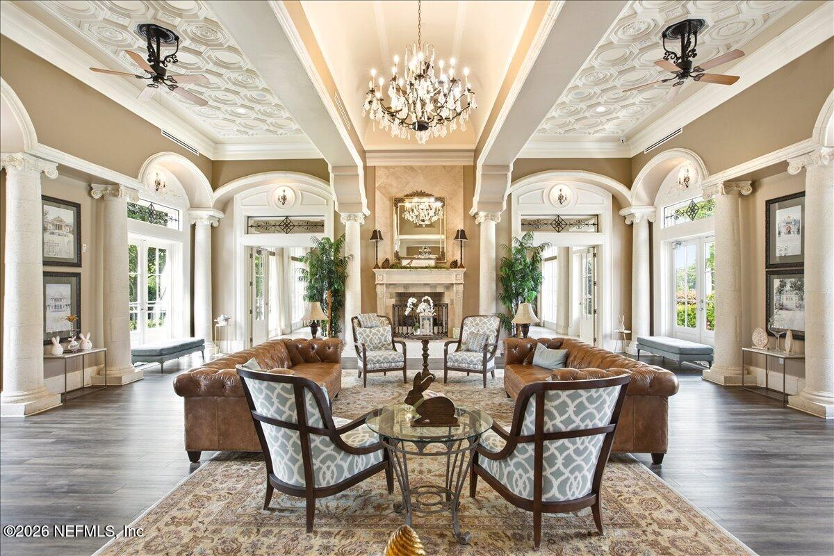 212 North Arabella Way St. Johns, FL 32259 - Photo 77 of 83 a dining room with wooden floor a chandelier a wooden table and chairs