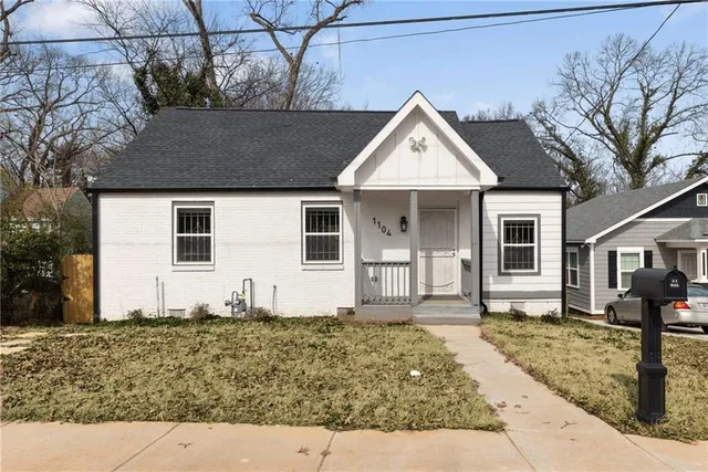 a front view of a house with garage