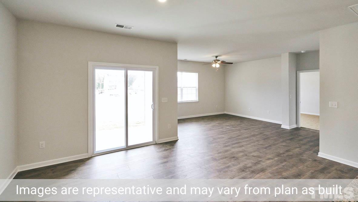 608 Rex Court Carthage, NC 28327 - Photo 16 of 22 an empty room with wooden floor and windows