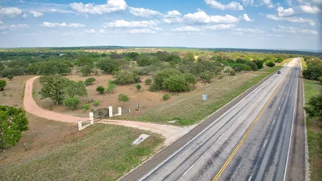a very nice looking room with a large window and stainless steel appliances