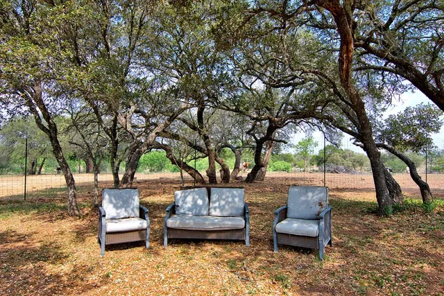 a living room with fireplace furniture and a flat screen tv