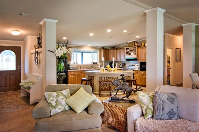 a bed room with a bed window and a chair