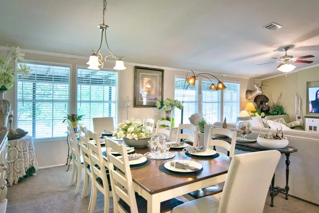 a bathroom with a double vanity sink toilet and a mirror
