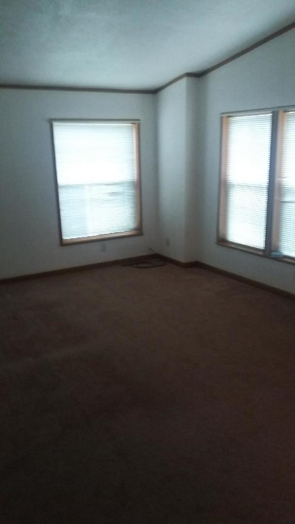 1045 Richard Road Elgin, IL 60123 - Photo 22 of 23 an empty room with a window