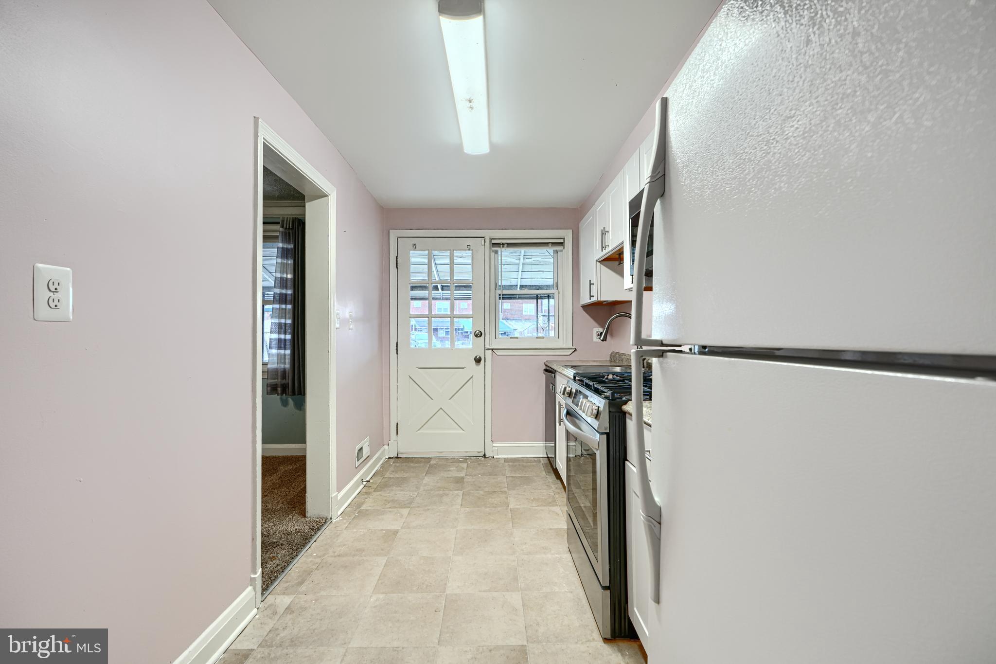 7807 Rockbourne Road Dundalk, MD 21222 - Photo 14 of 31 a view of a kitchen from the hallway