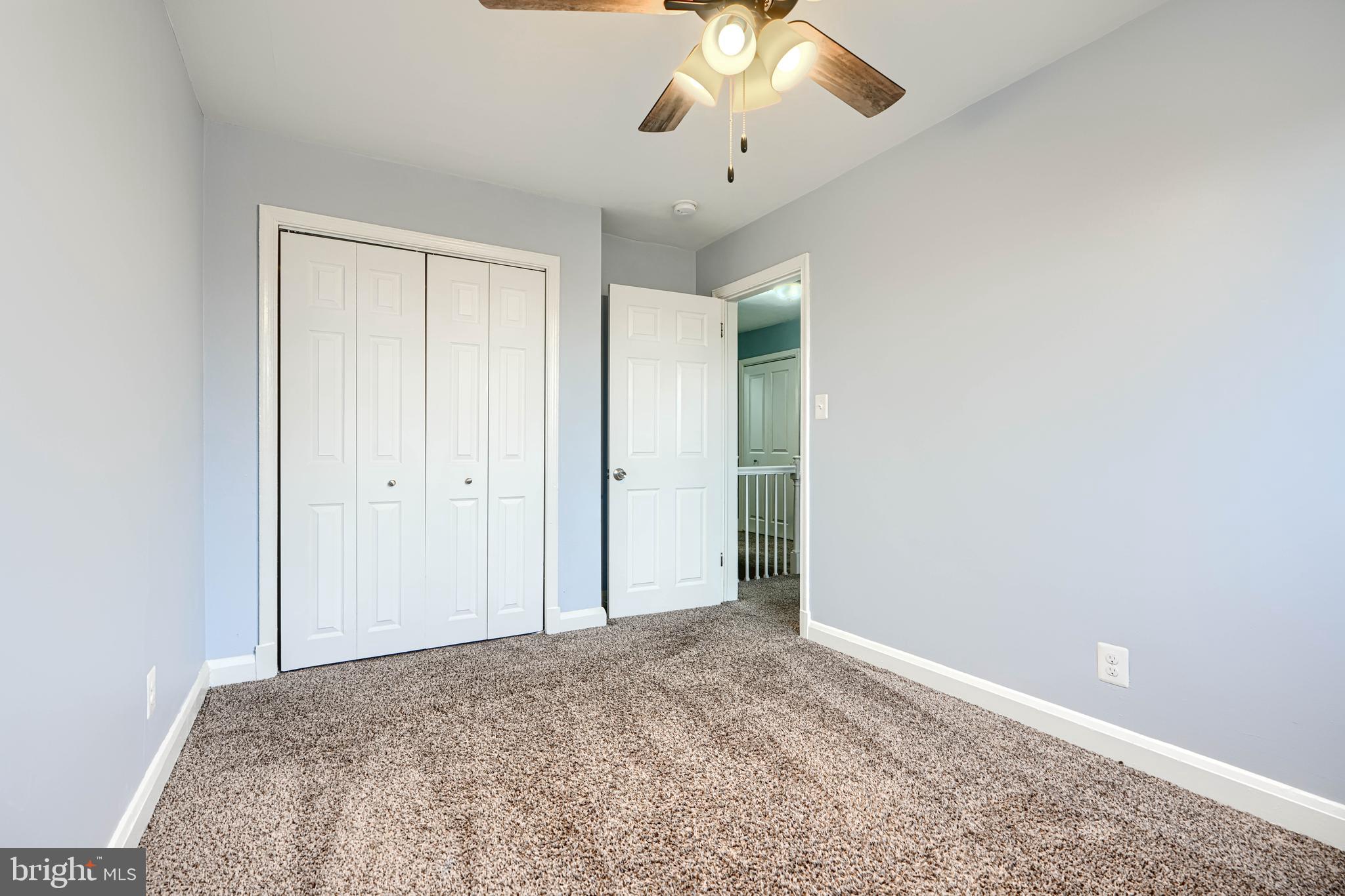 7807 Rockbourne Road Dundalk, MD 21222 - Photo 23 of 31 a view of a livingroom with a chandelier fan