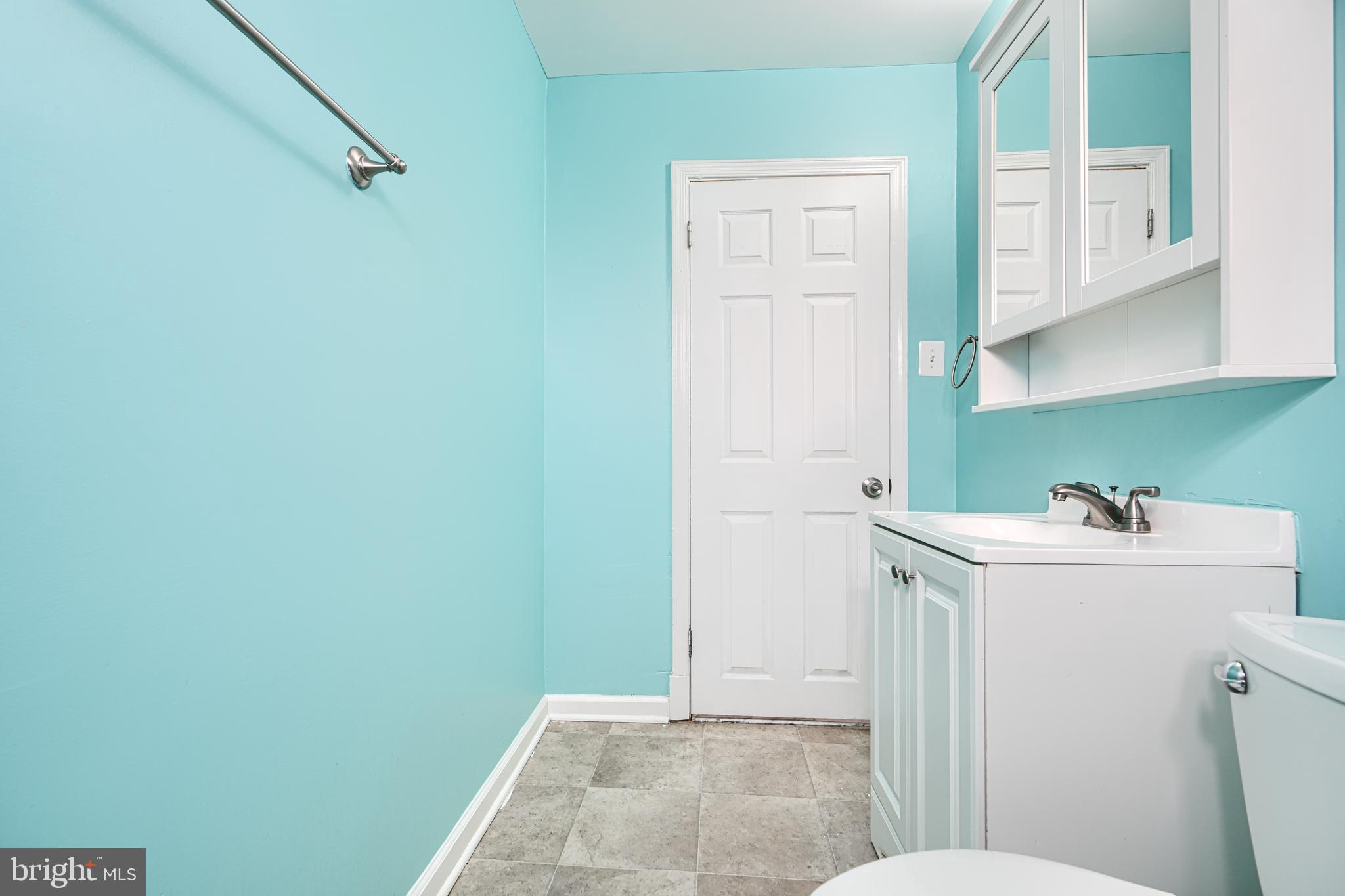 7807 Rockbourne Road Dundalk, MD 21222 - Photo 26 of 31 a bathroom with a sink and toilet