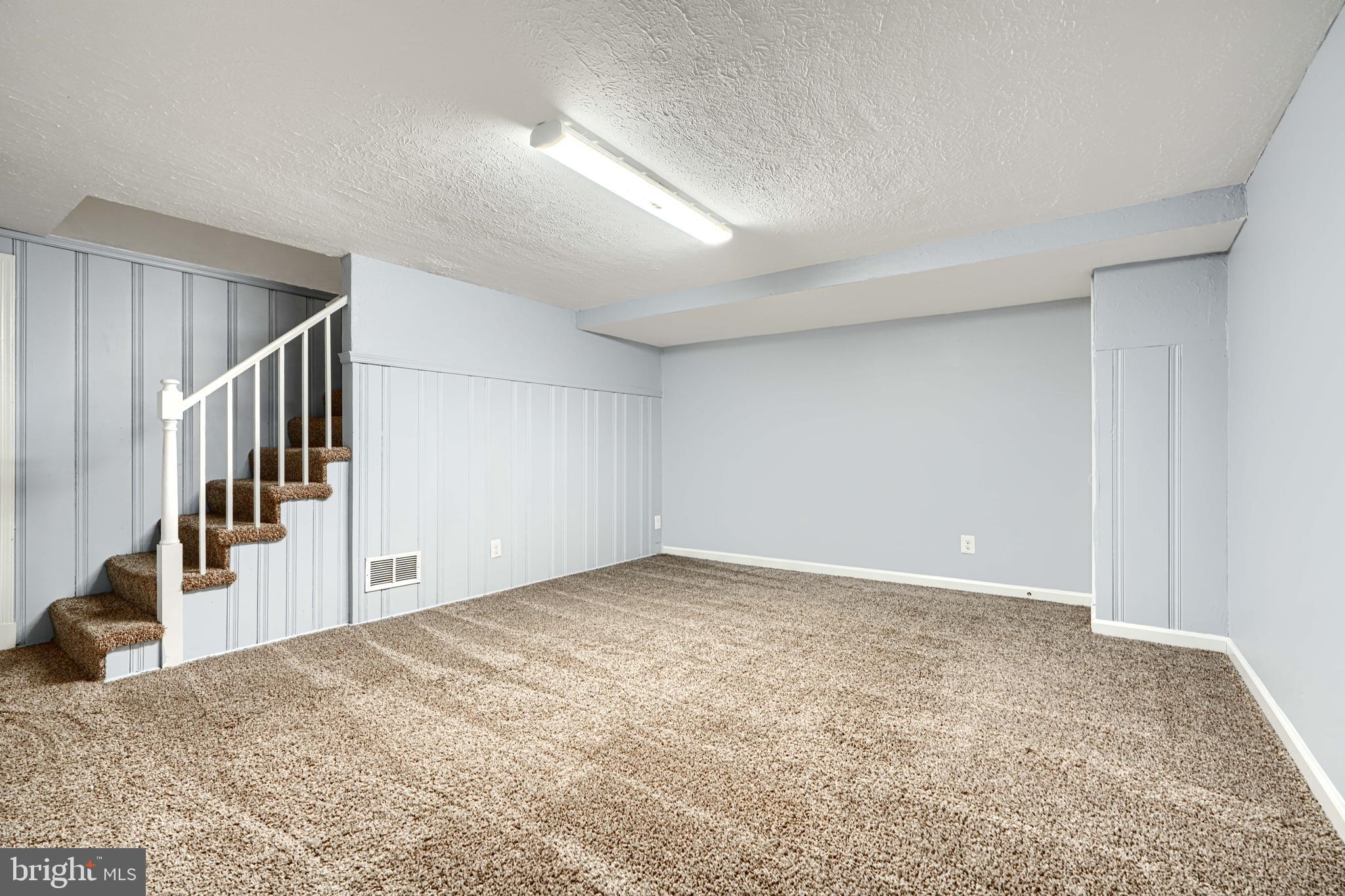 7807 Rockbourne Road Dundalk, MD 21222 - Photo 28 of 31 a view of an empty room and stairs