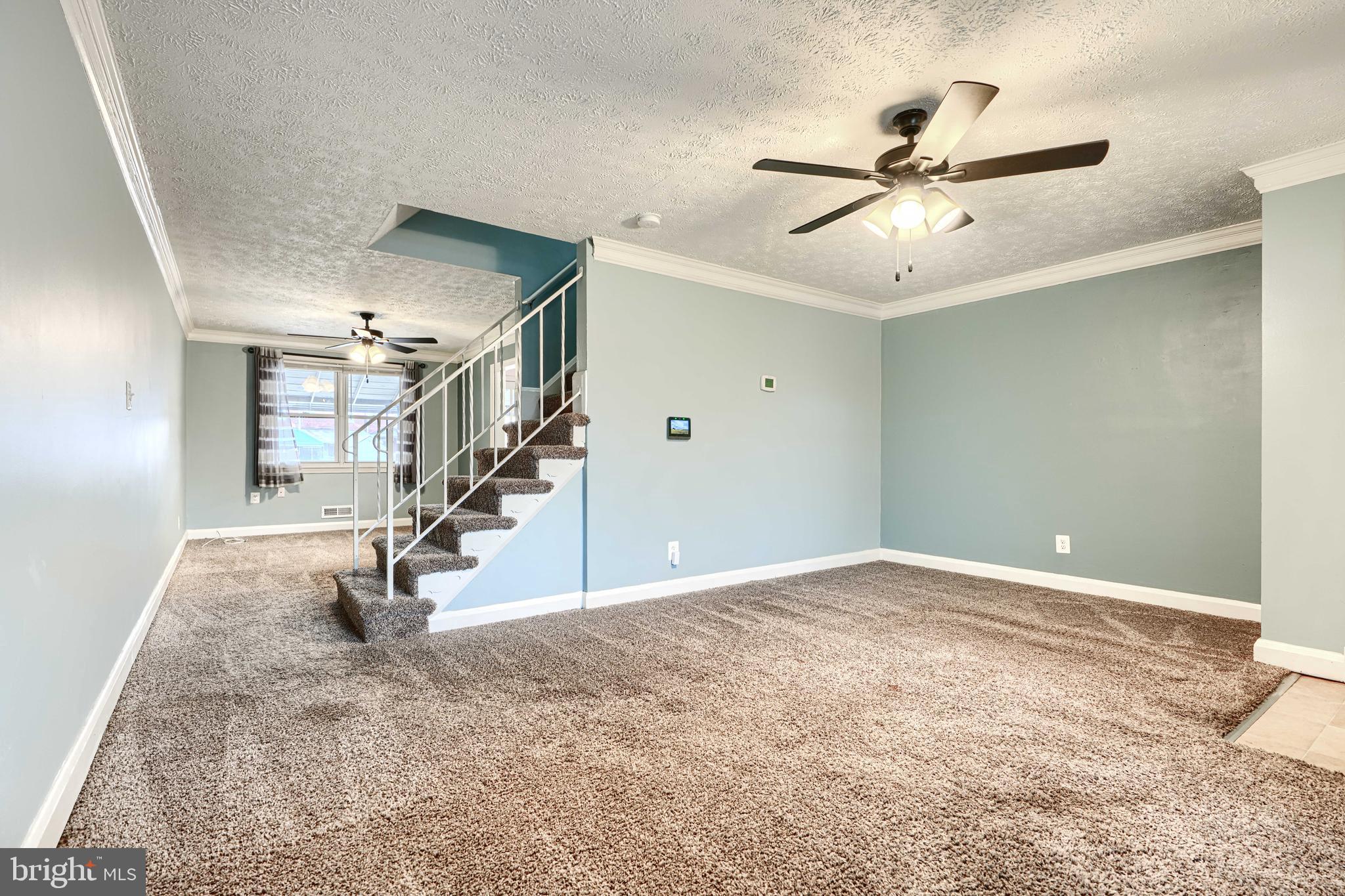 7807 Rockbourne Road Dundalk, MD 21222 - Photo 6 of 31 a view of an empty room with stairs