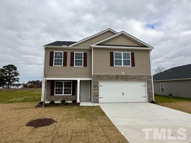 7621 Sand Pit Road Stantonsburg, NC 27883 - Photo 1 of 58 a front view of a house with a yard