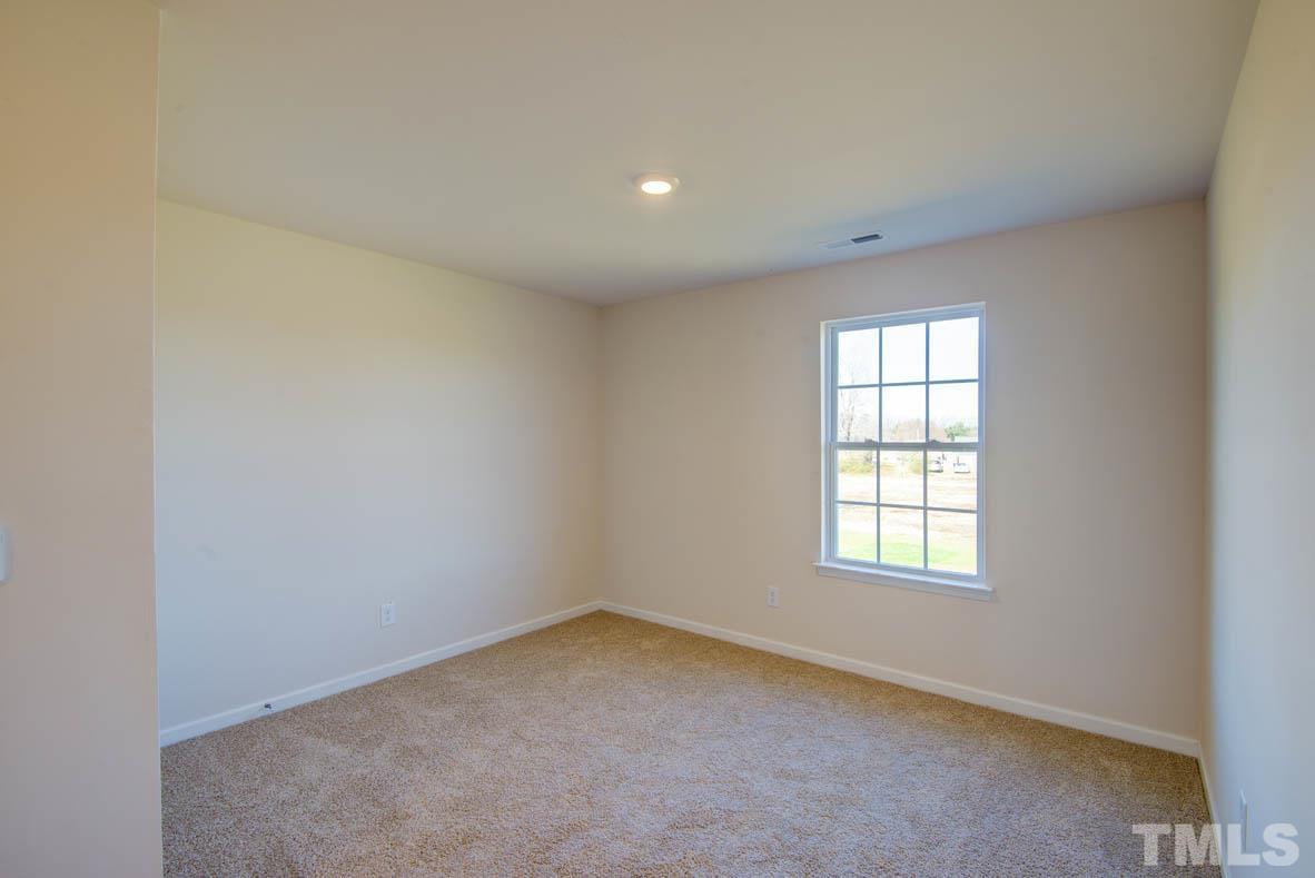 7621 Sand Pit Road Stantonsburg, NC 27883 - Photo 36 of 58 an empty room with a window