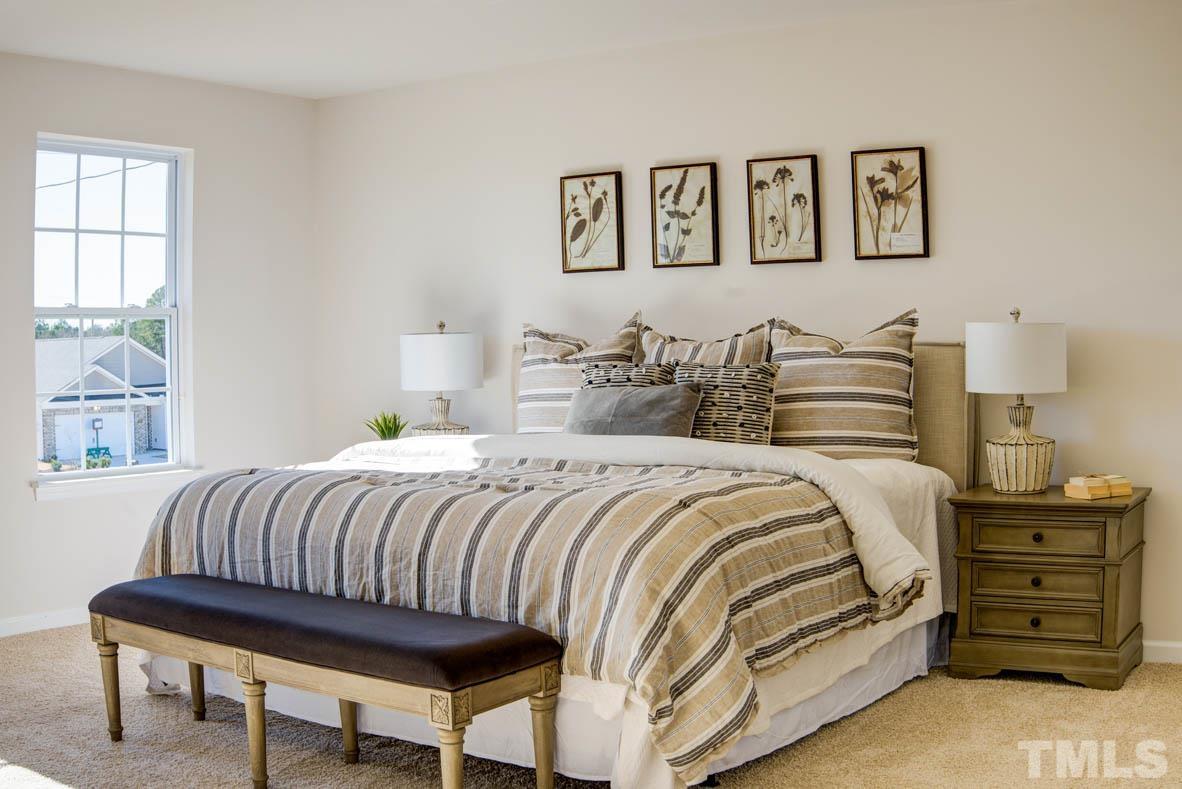 7621 Sand Pit Road Stantonsburg, NC 27883 - Photo 57 of 58 a bedroom with a bed and a window