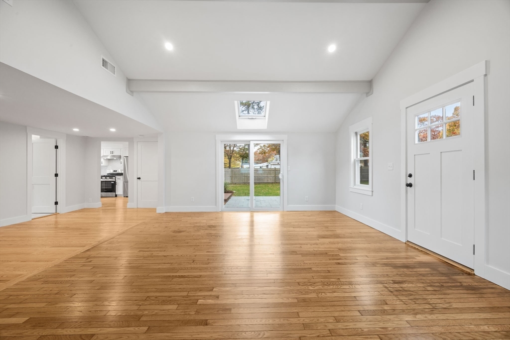 18 Martin Street Wareham, MA 02532 - Photo 11 of 42 a view of an empty room with wooden floor and a window