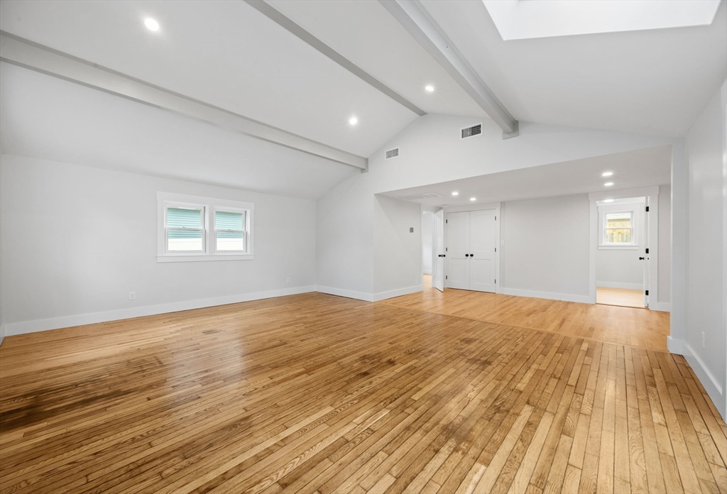 18 Martin Street Wareham, MA 02532 - Photo 12 of 42 an empty room with wooden floor and windows