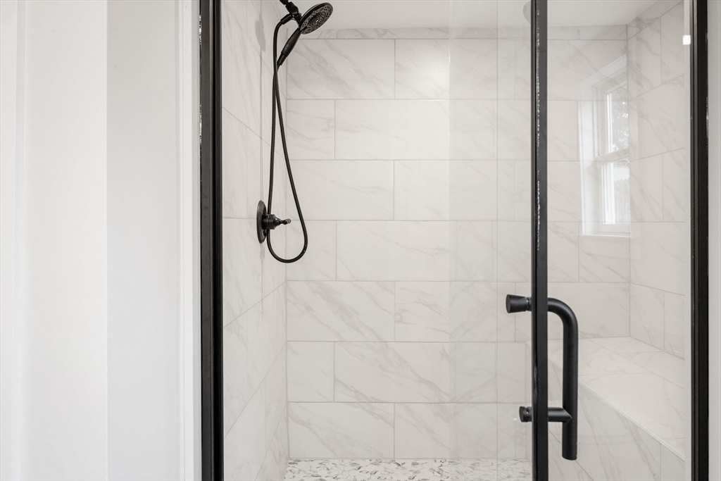 18 Martin Street Wareham, MA 02532 - Photo 23 of 42 a bathroom with a glass shower door