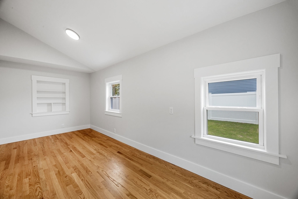 18 Martin Street Wareham, MA 02532 - Photo 29 of 42 a view of empty room with wooden floor and fan