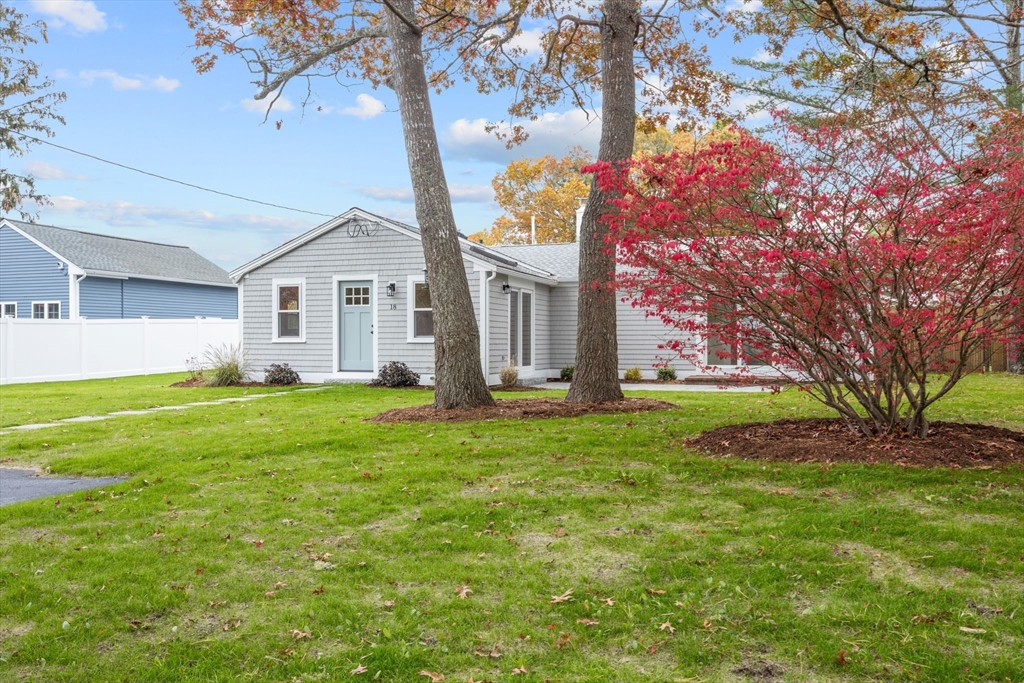 18 Martin Street Wareham, MA 02532 - Photo 6 of 42 a front view of house with yard and green space