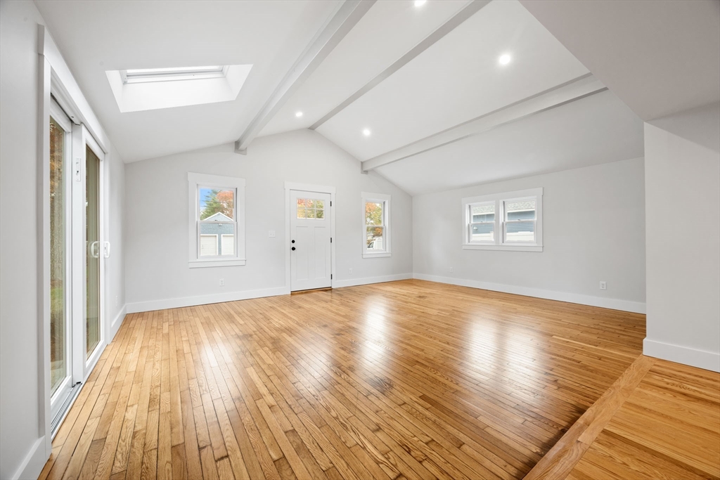 18 Martin Street Wareham, MA 02532 - Photo 10 of 42 an empty room with wooden floor and windows