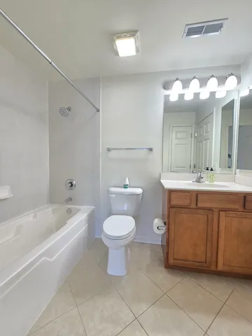 a bathroom with a sink a toilet and a bathtub