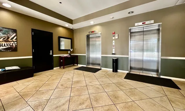 a large bathroom with a bathtub and a shower