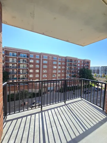 a view of balcony with wooden floor