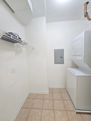 a view of a storage & utility room with two washing machine