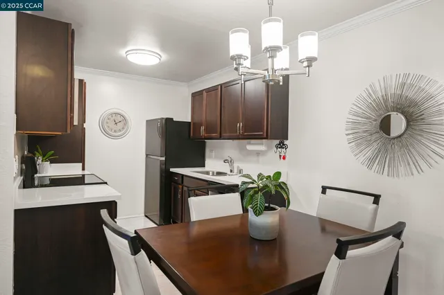 a dining room with furniture a window and wooden floor
