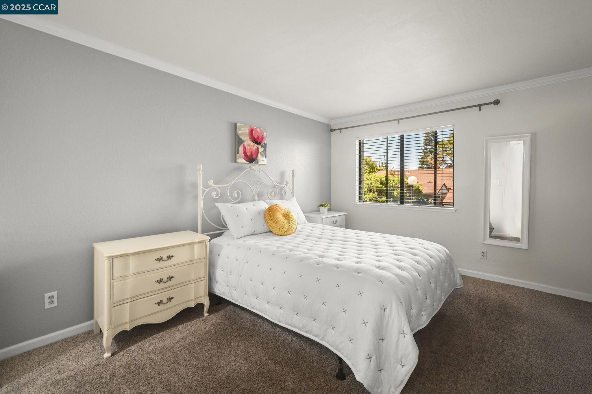 1411 Marchbanks Drive, Unit 2 Walnut Creek, CA 94598 - Photo 14 of 42 a bedroom with a bed and a window