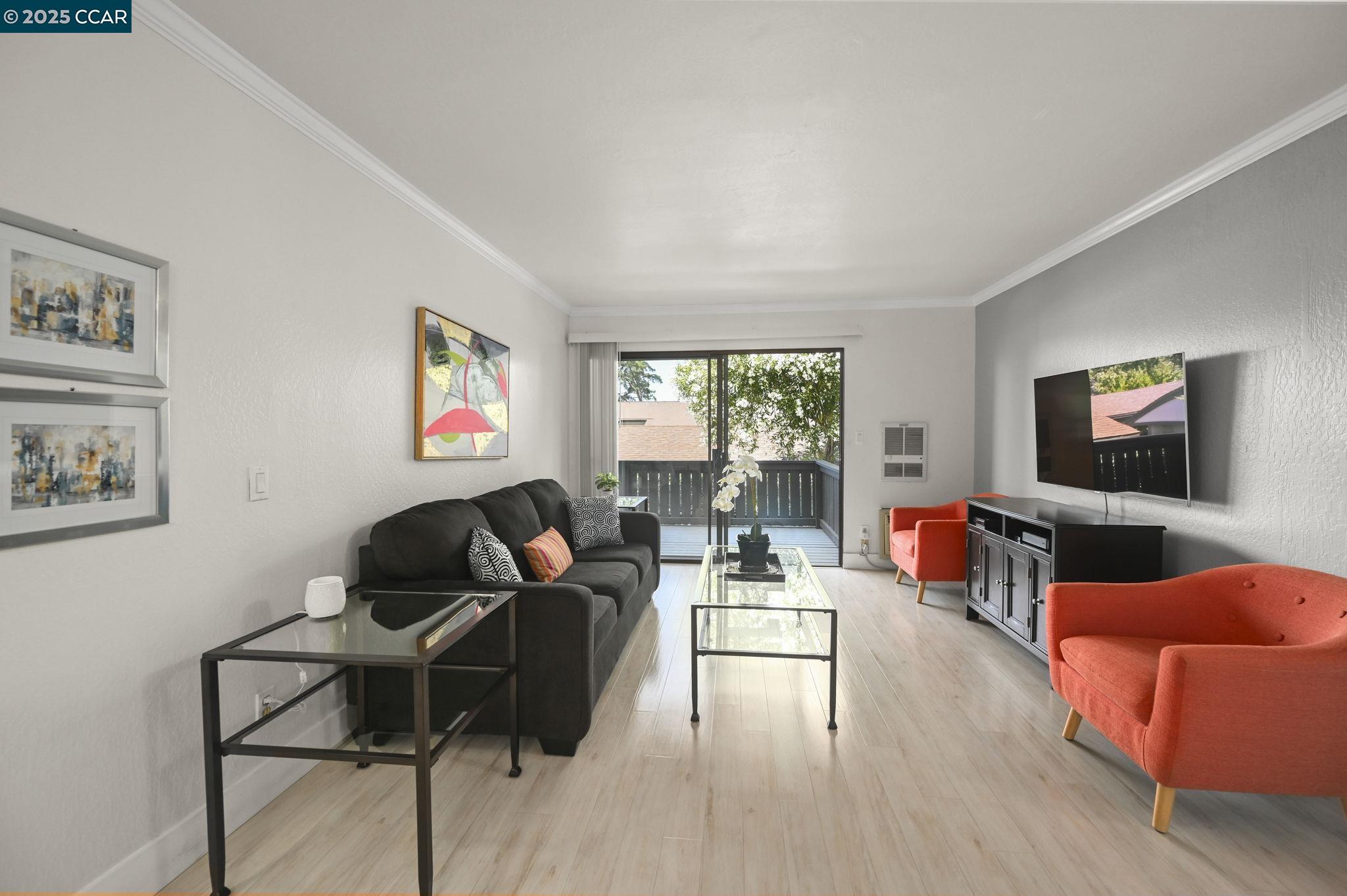 1411 Marchbanks Drive, Unit 2 Walnut Creek, CA 94598 - Photo 2 of 42 a living room with furniture and a flat screen tv