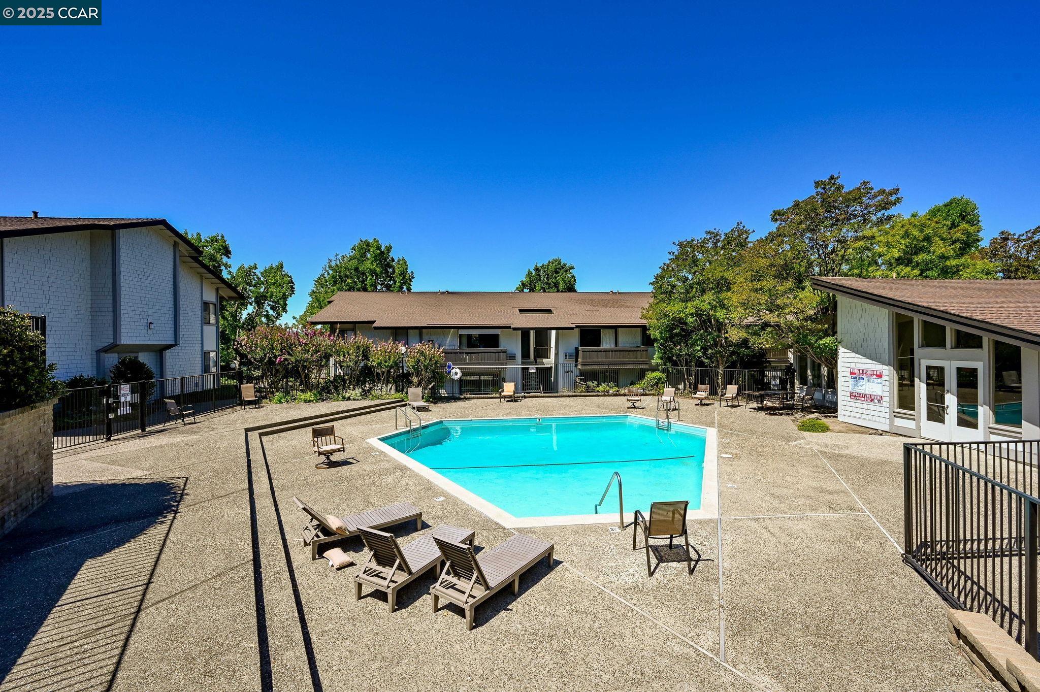 1411 Marchbanks Drive, Unit 2 Walnut Creek, CA 94598 - Photo 24 of 42 a view of a house with swimming pool and sitting area