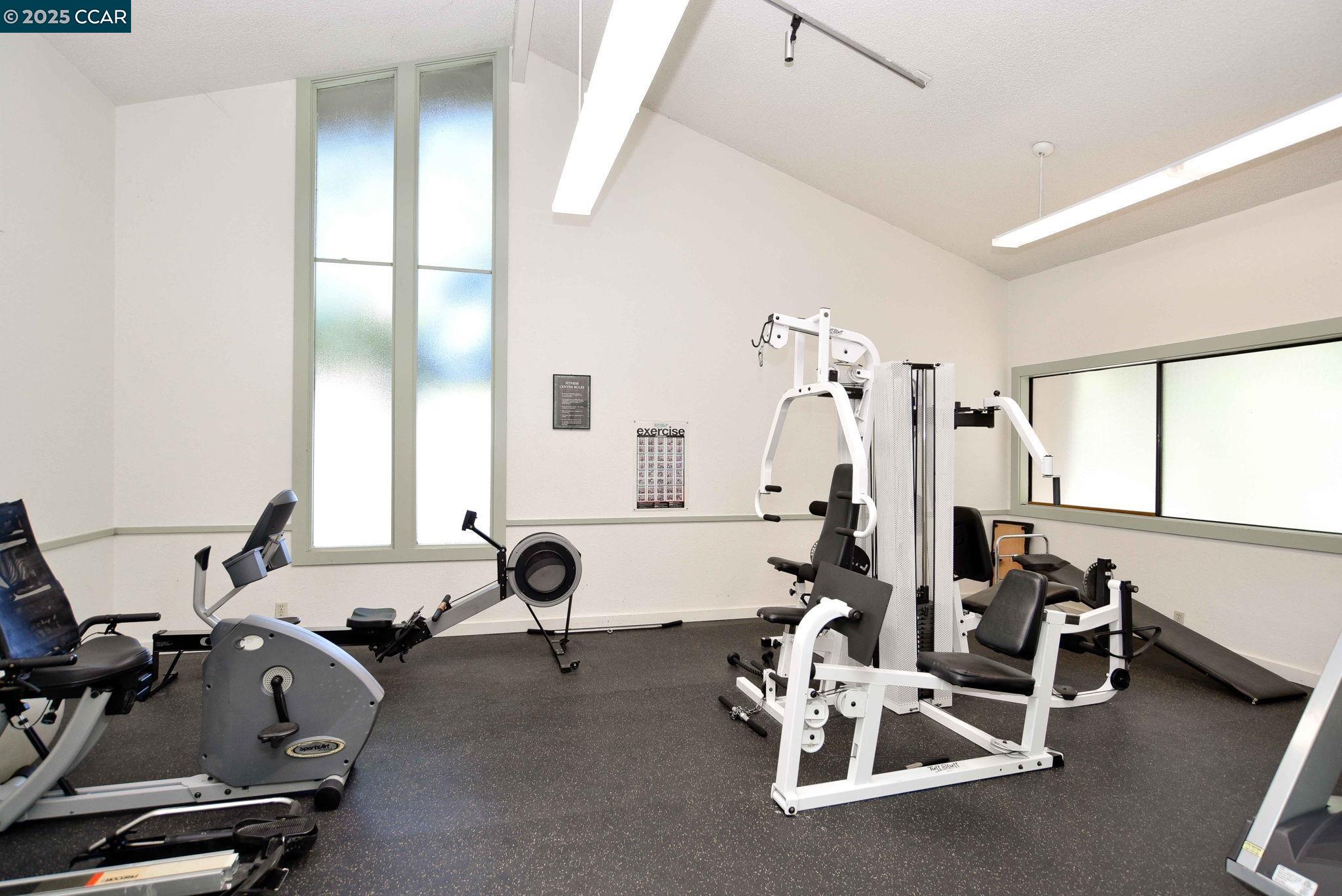 1411 Marchbanks Drive, Unit 2 Walnut Creek, CA 94598 - Photo 26 of 42 a room with gym equipment and a large window