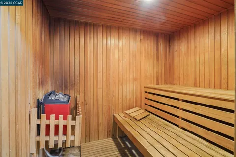 a room with furniture pool table and windows