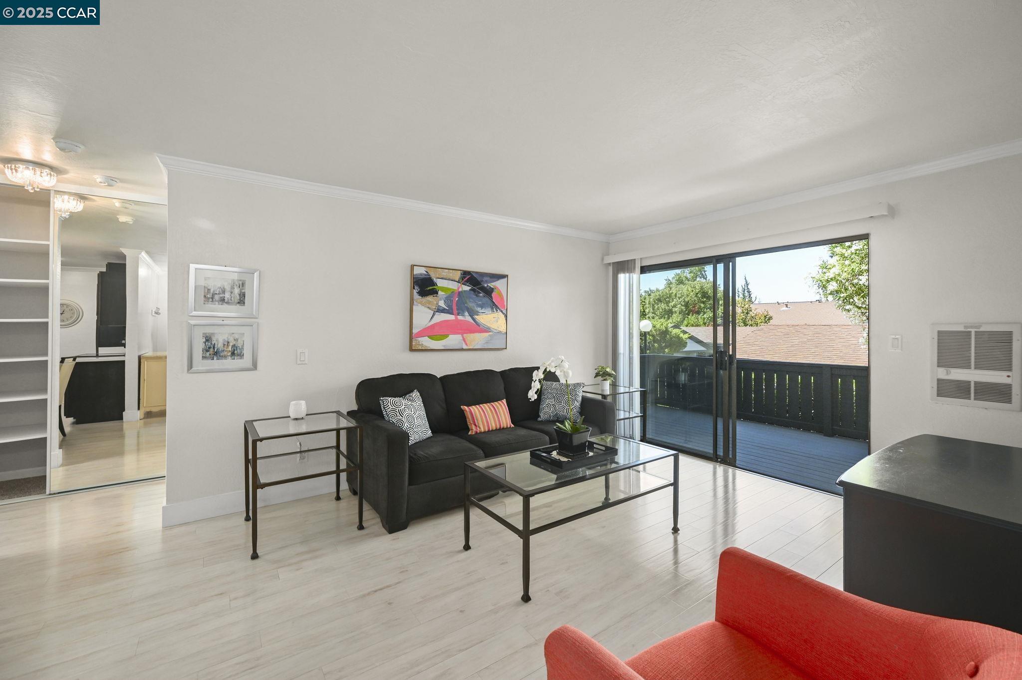1411 Marchbanks Drive, Unit 2 Walnut Creek, CA 94598 - Photo 3 of 42 a living room with furniture and a floor to ceiling window