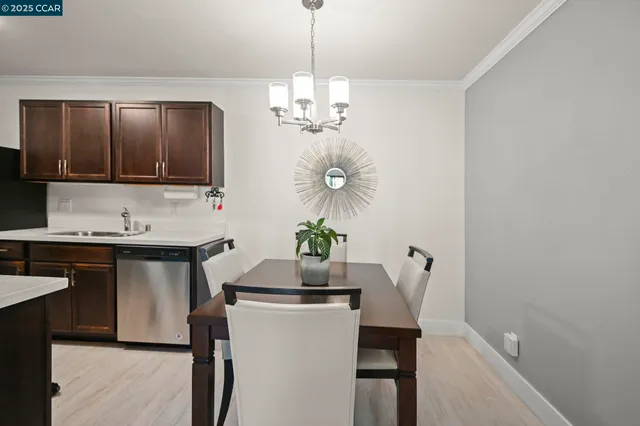 a kitchen with a table and chairs in it