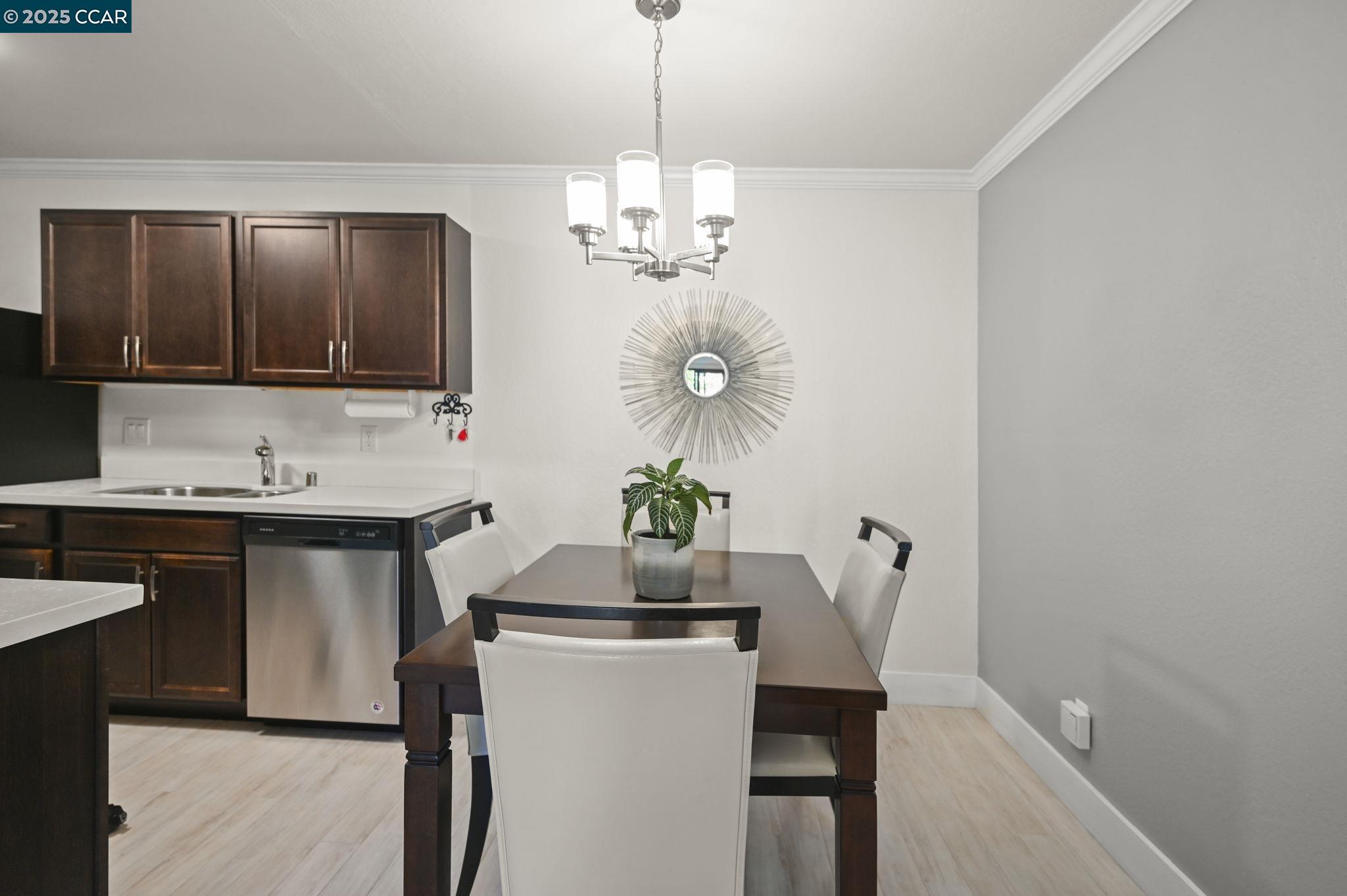 1411 Marchbanks Drive, Unit 2 Walnut Creek, CA 94598 - Photo 9 of 42 a kitchen with a table and chairs in it
