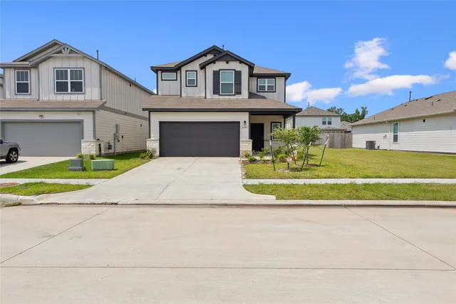 a view of a house with a swimming pool and a yard