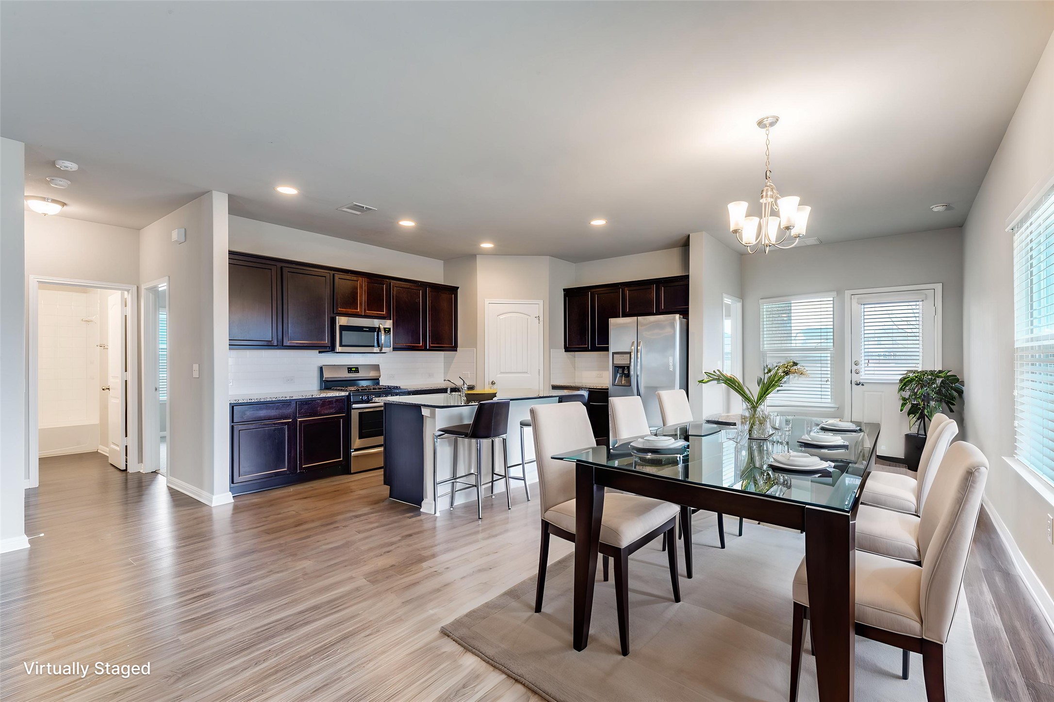 348 Shiner Lane Georgetown, TX 78626 - Photo 13 of 37 a view of a dining room with furniture window and wooden floor