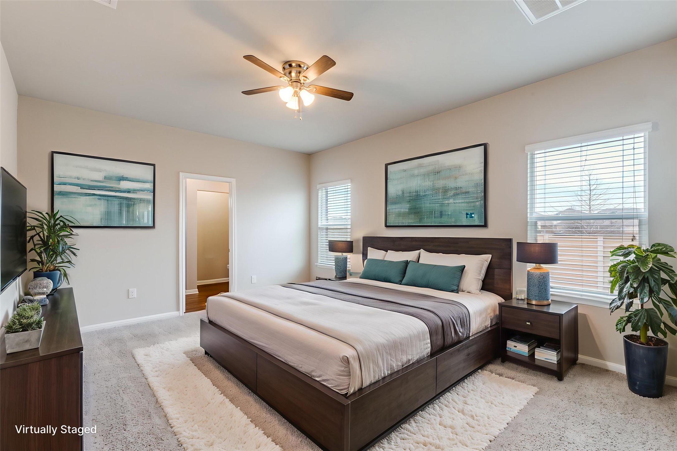 348 Shiner Lane Georgetown, TX 78626 - Photo 15 of 37 a bedroom with a large bed and a chandelier