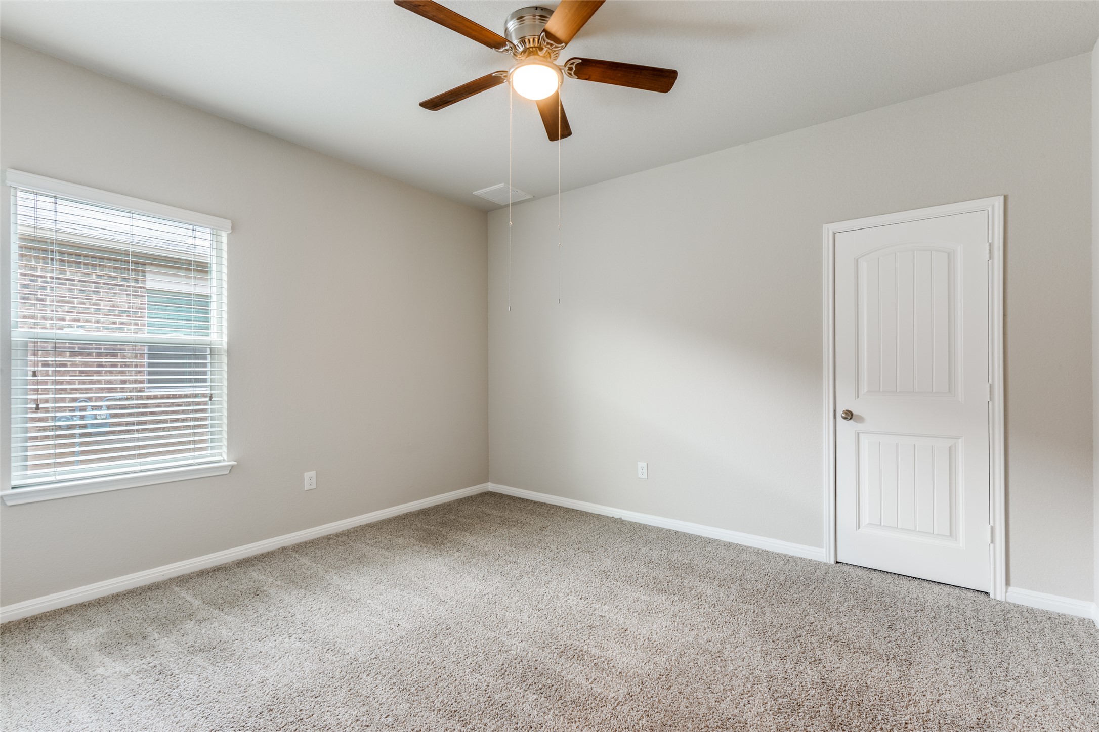348 Shiner Lane Georgetown, TX 78626 - Photo 19 of 37 a view of an empty room with window and a chandelier fan