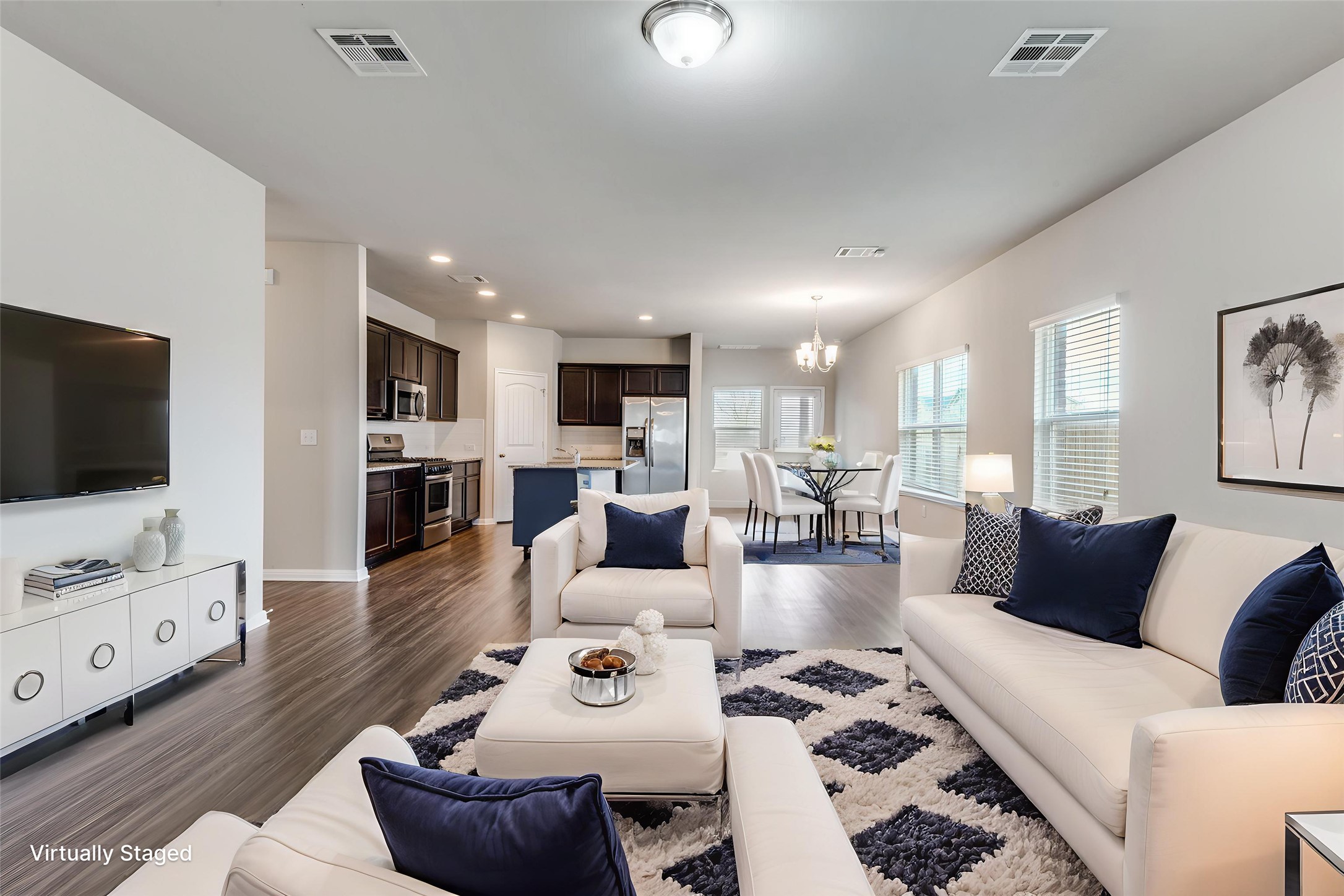 348 Shiner Lane Georgetown, TX 78626 - Photo 2 of 37 a living room with furniture and a flat screen tv