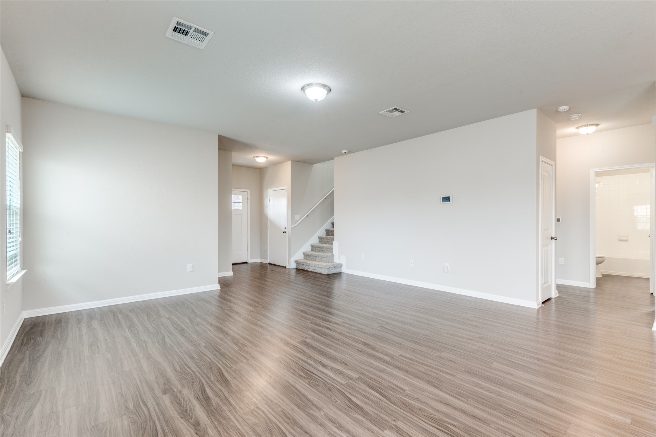 348 Shiner Lane Georgetown, TX 78626 - Photo 24 of 37 a view of an empty room with wooden floor