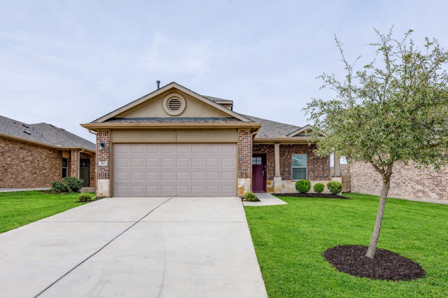 348 Shiner Lane Georgetown, TX 78626 - Photo 37 of 37 a front view of a house with a yard and garage
