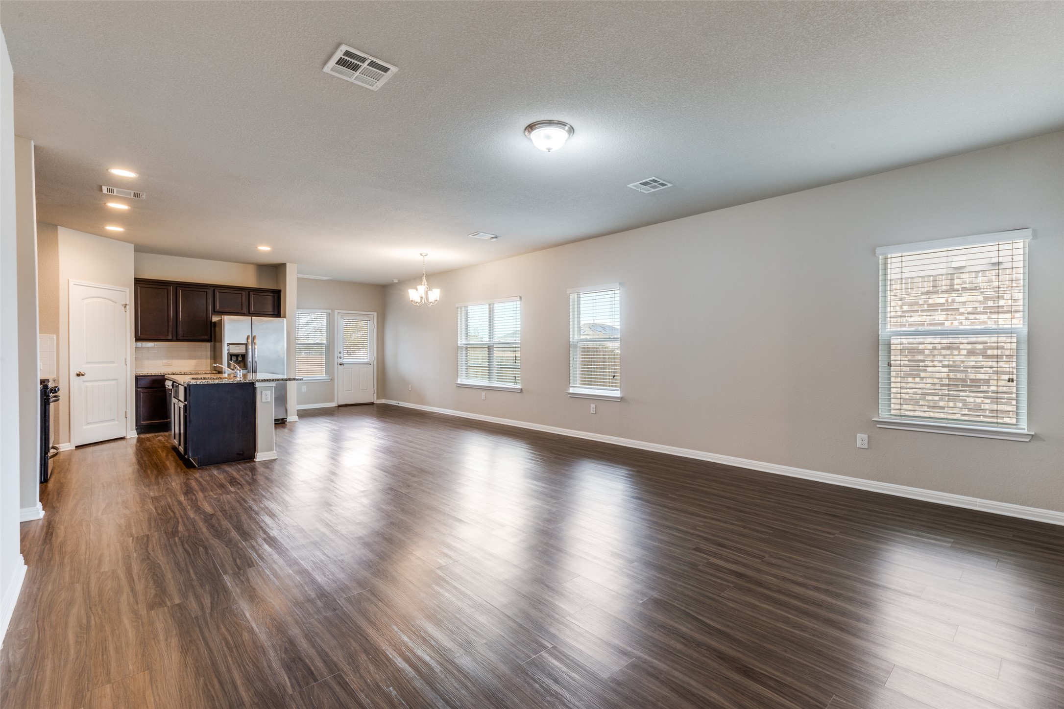 348 Shiner Lane Georgetown, TX 78626 - Photo 7 of 37 a view of kitchen with cabinets and wooden floor