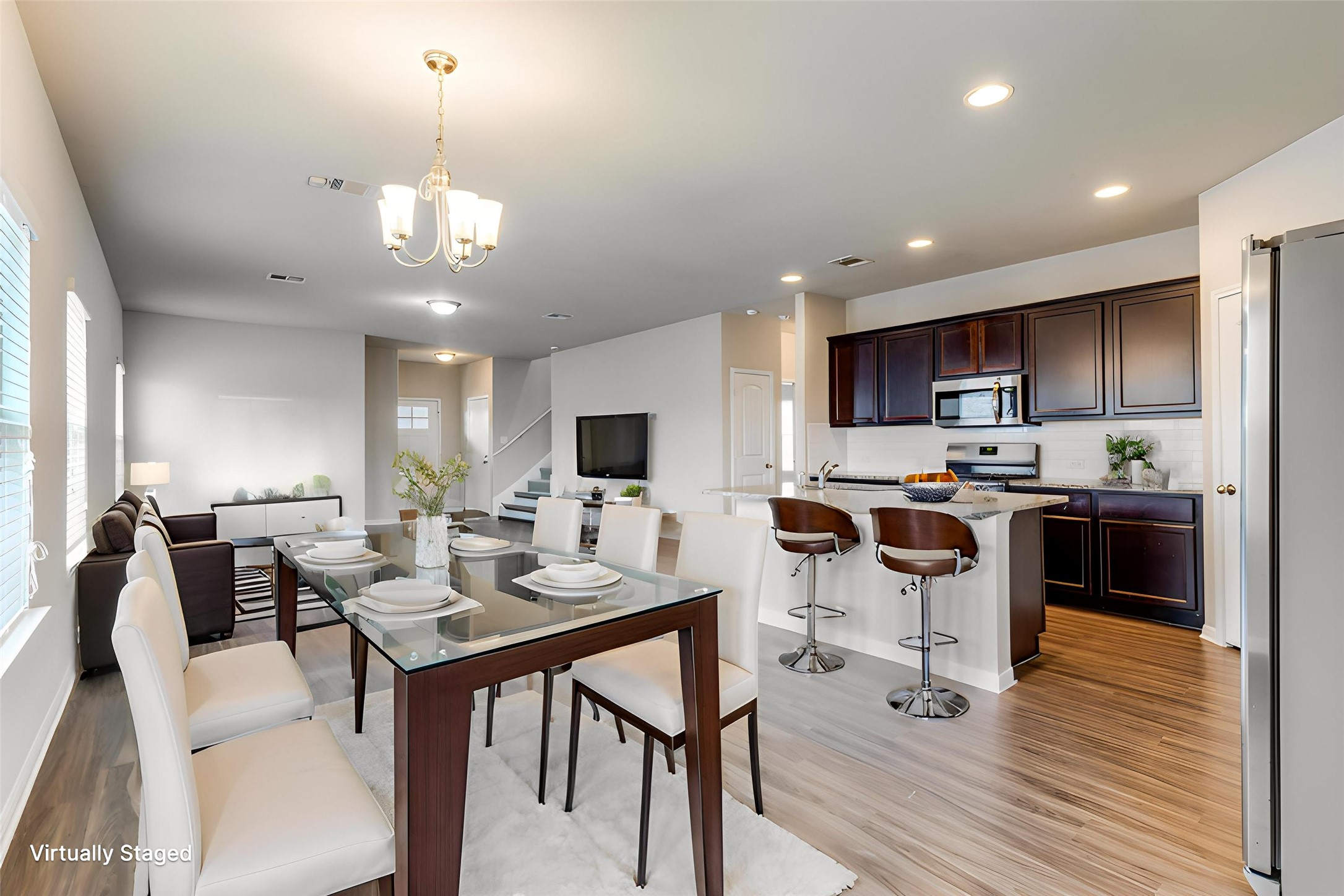 348 Shiner Lane Georgetown, TX 78626 - Photo 8 of 37 a view of kitchen with refrigerator stove dining table and chairs