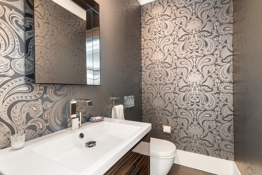 72 Love Lane Weston, MA 02493 - Photo 19 of 41 a bathroom with a sink and a toilet