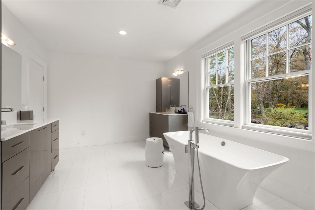 72 Love Lane Weston, MA 02493 - Photo 26 of 41 a bathroom with a granite countertop sink and a bathtub