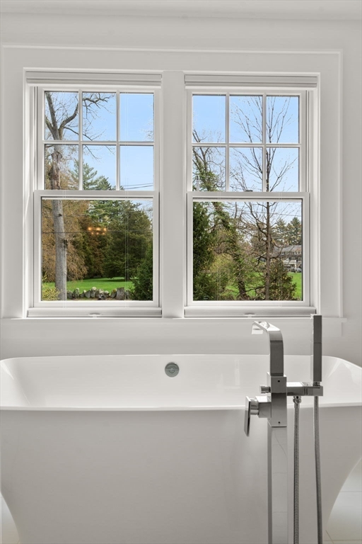 72 Love Lane Weston, MA 02493 - Photo 27 of 41 a bathroom with a bathtub and next to a window