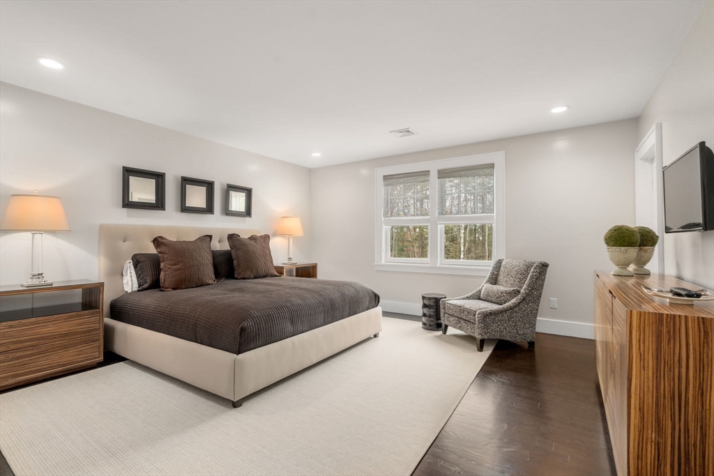 72 Love Lane Weston, MA 02493 - Photo 28 of 41 a spacious bedroom with a bed and window
